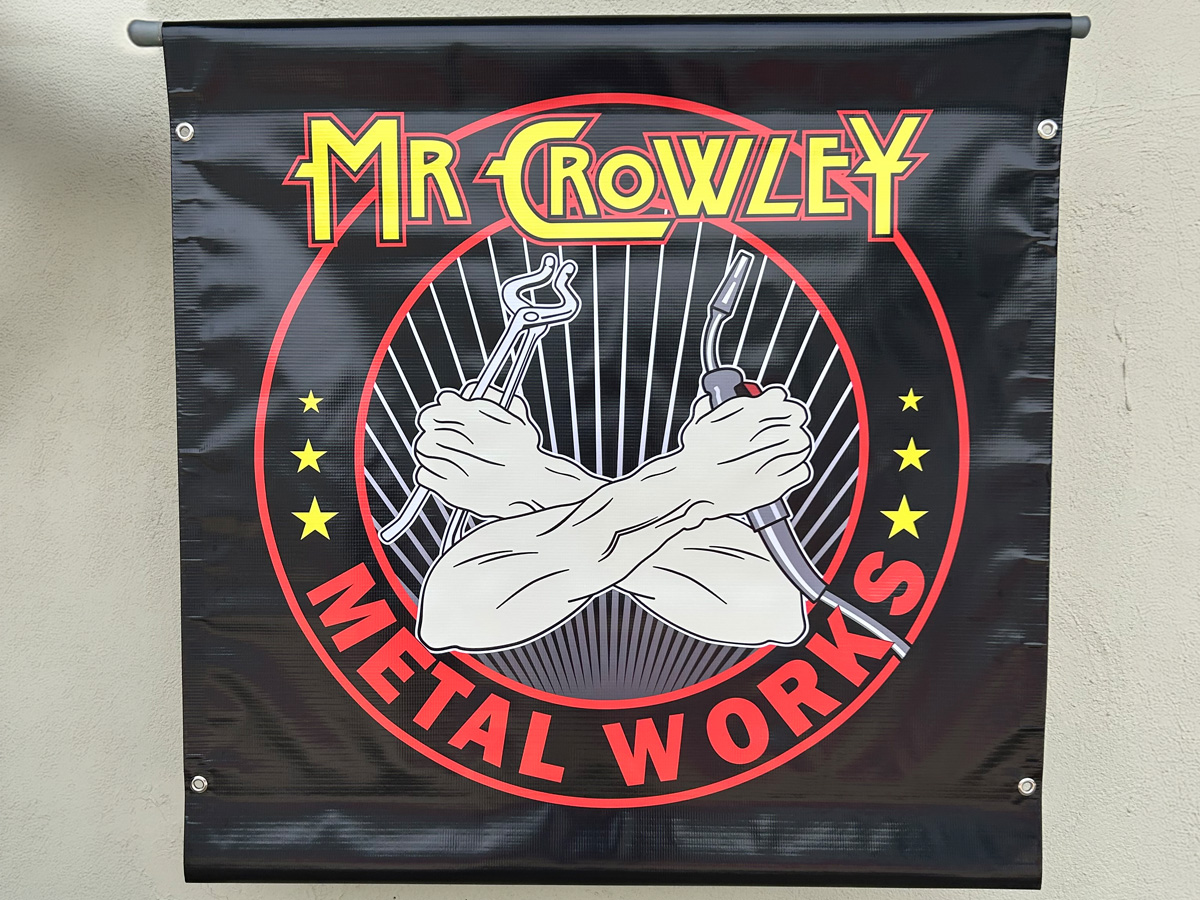Mr Crowley Metal Works custom black banner with full-color illustrated logo