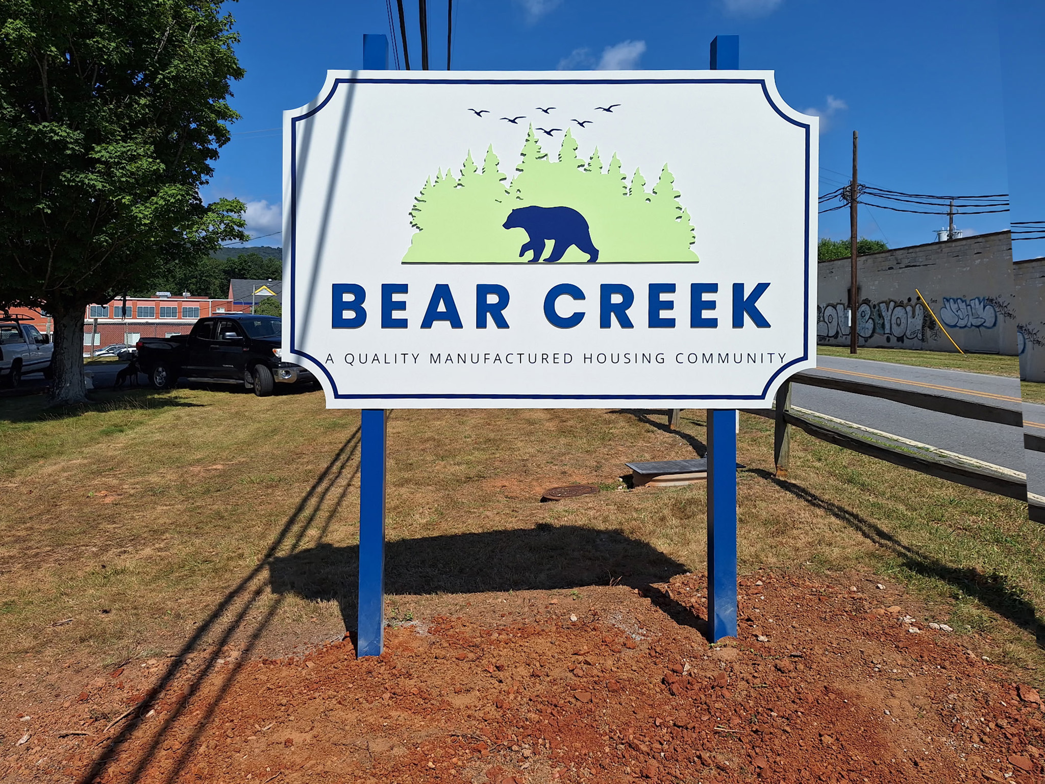 Bear Creek manufactured housing community entrance sign with powder-coated metal face posts and dimensional lettering in Asheville North Carolina
