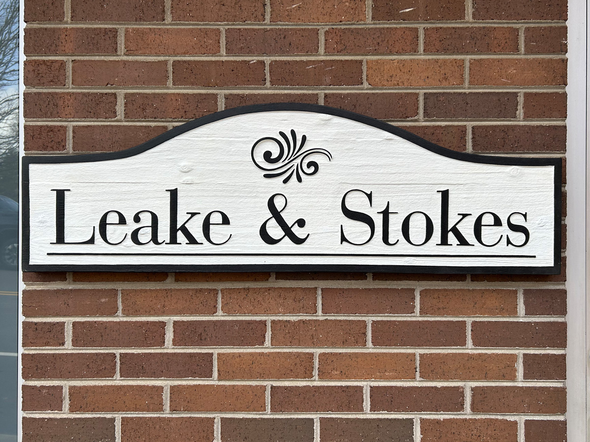 Leake and Stokes custom carved dimensional sign installed on brick in Mars Hill North Carolina