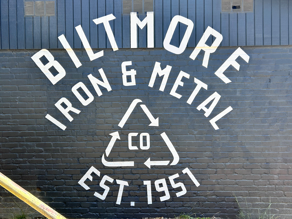 Hand-painted Biltmore Iron and Metal Company BIMCO mural on exterior brick wall in Asheville North Carolina